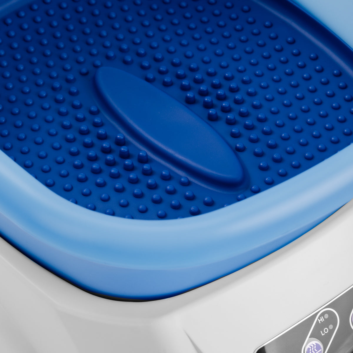 Pedicure bakke med massageapparat og sort vogn